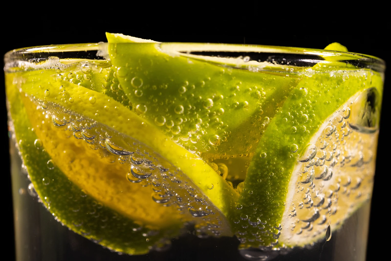 Fresh citrus beverage with lime slices representing Apex Biotech beverage and liquid premix solutions