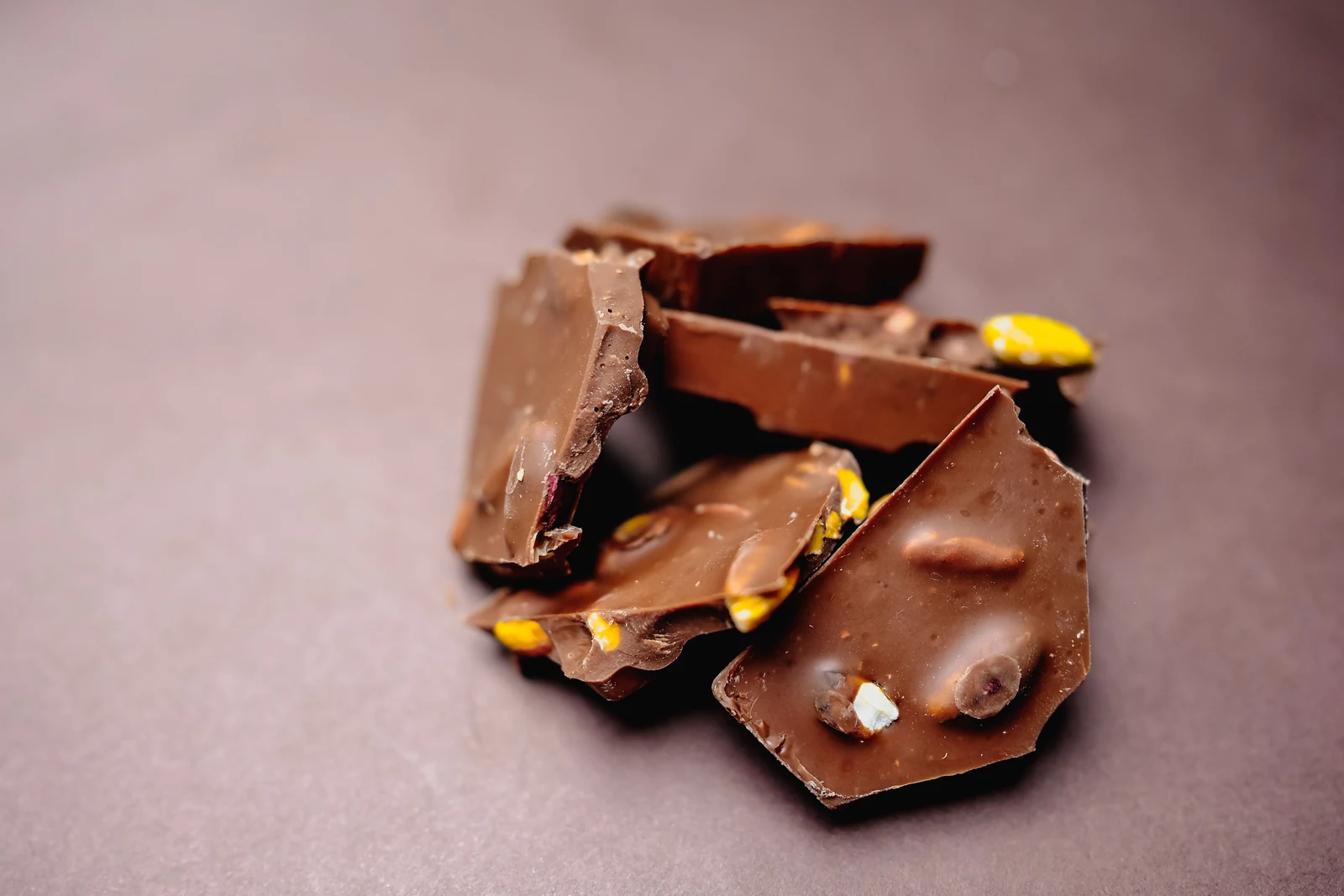 Chocolate and confectionery textures representing Apex Biotech snack and bar ingredient solutions